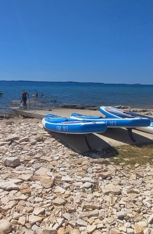 barbariga beach boats